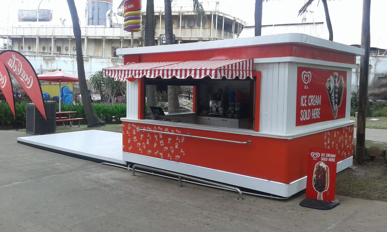 Ola branded ice cream kiosk signage
